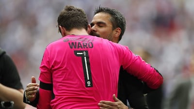 Huddersfield Town manager David Wagner and Danny Ward celebrate after winning the Championship Play-Off Final and getting promoted to the Premier League. Reuters