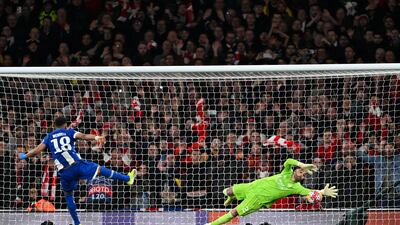 David Raya dives low to his left to save the second penalty from Wendell. Getty Images