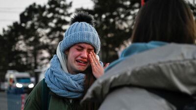 An Ukrainian girl in tears after crossing the border in Siret, northern Romania. AFP