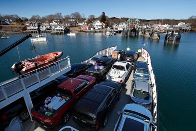 A ferry arrives at North Haven, Maine, on March 16, 2020 as visitor numbers start to rise. The island is seeking to deter arrivals this year because of the coronavirus outbreak. AP Photo