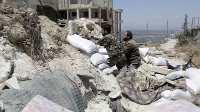 Ahrar Al Sham fighters are seen taking positions in Jabal Al Arbaeen, Idlib province, on November 12, 2016. Khalil Ashawi / Reuters