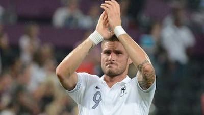 French forward Olivier Giroud salutes supporters at the end of the Euro 2012 defeat to Spain.