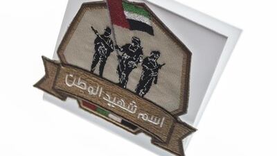 One of the badges that will be labelled with the name of a martyr and sent to the International Space Station. Antonie Robertson / The National