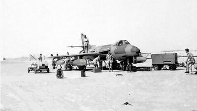 With no hangar available in the 1960s, all servicing at Sharjah's airbase was carried out under a scorching sun as with the undercarriage checks seen here. Courtesy of Ray Deacon