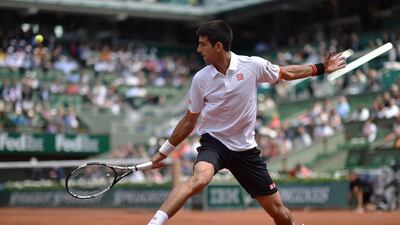 Serbia’s Novak Djokovic returns the ball to Australia’s Thanasi Kokkinakis during the men’s third round at the Roland Garros 2015 French Tennis Open in Paris on May 30, 2015. AFP PHOTO / PASCAL GUYOT