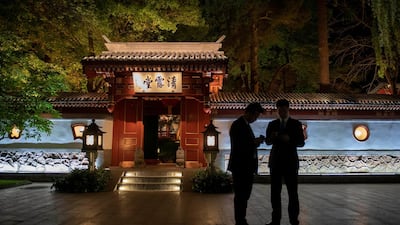 Two security guards secure an area as China's Foreign Minister Wang Yi (not seen) meets for talks with his French counterpart Jean-Yves Le Drian (not seen) at Diaoyutai State Guesthouse in Beijing, China. Reuters