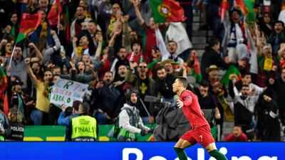 Ronaldo celebrates in front of supporters. AP Photo