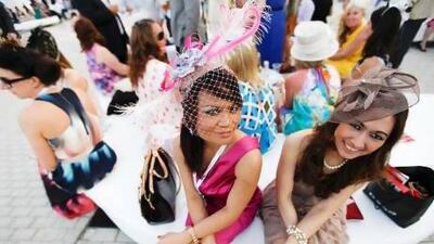 Leny Layburn (left) and Tri Angela relax between races at the Dubai World Cup at Meydan in Dubai. (Sarah Dea/The National)