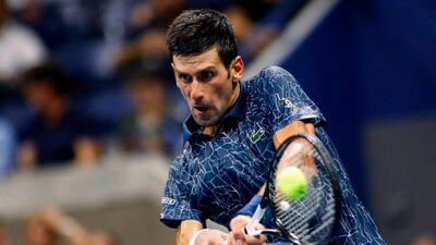 Djokovic hits a return to Millman. AFP