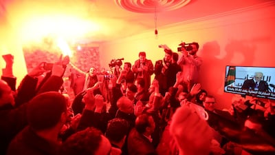 Supporters react at the campaign headquarters of Abdelmadjid Tebboune after he was announced as the new president in Algiers. Reuters