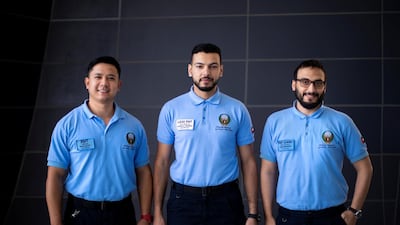 Emergency medical technician Emmanuel Lim, Mohammed Al Shdaifat, lead emergency medical technician and Audai Masadeh, shift leader, are working to improve patient care for the National Ambulance service. Reem Mohammed/The National
