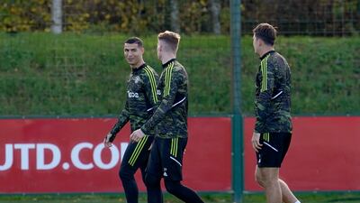 Manchester United's Cristiano Ronaldo with Scott McTominay during training. PA