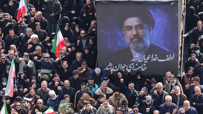 The face of Iran's new supreme leader Mojtaba Khamenei was displayed during funerals for assassinated commanders in Tehran. AFP
