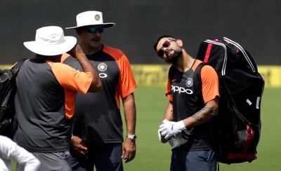 India captain Virat Kohli, right, and coach Ravi Shastri, centre, have failed in effectively communicating with the media. Rajanish Kakade / AP Photo