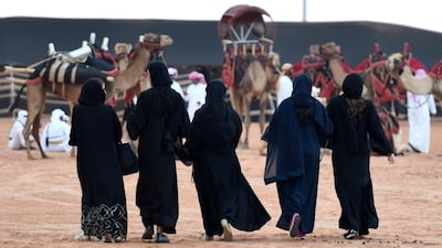 Saudi women attend the first official King Abdulazziz Camel Festival in the village of Al Sayaheed, Rumah, on March 29, 2017. Fayez Nureldine / AFP Photo