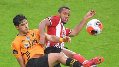 Richairo Zivkovic, right, of Sheffield in action against Raul Jimenez of Wolverhampton. EPA