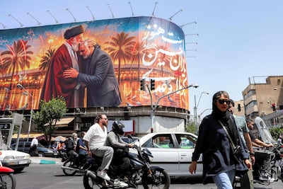 Iran's late supreme leader Ayatollah Ali Khamenei, seen on this billboard in Tehran, was killed on the opening day of the Israeli-US war on Iran. AFP