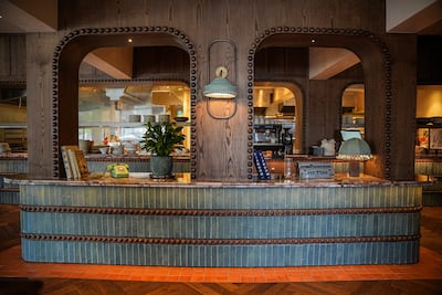 Deep rich wood and colourful tiles evoke a cosy feel. Photo: Khadak