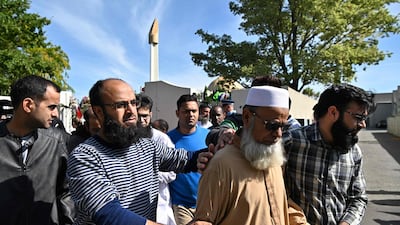 Members of the Muslim community react as they leave the Al Noor Mosque in Christchurch after it was opened to members of the public in groups of 15 at a time. AFP