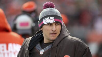 Cleveland Browns quarterback Johnny Manziel watches on the sidelines during the second half of an NFL football game against the Denver Broncos, in Cleveland. Police have released a dash-cam video and 911 emergency calls from a roadside incident involving Manziel. The former Heisman Trophy winner was questioned by Avon, Ohio, police last week after Manziel got into an argument with his girlfriend, Colleen Crowley. (AP Photo/Aaron Josefczyk)