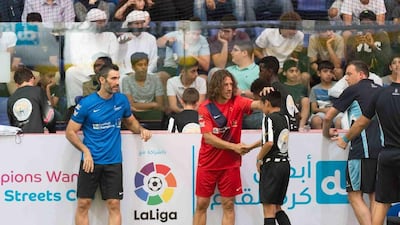 Carles Puyol, centre, the former Barcelona and Spain defender, and Fernando Sanz, left, the former Real Madrid defender, at the du FC grand final at Dubai Mall. Courtesy Inspirat
