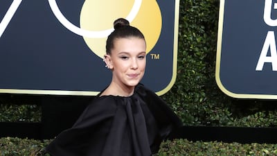 Millie Bobby Brown, wearing black Calvin Klein, arrives for the Golden Globe Awards on January 7, 2018. EPA