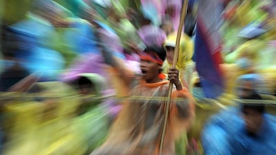 A supporter of the opposition Cambodia National Rescue Party (CNRP) shouts slogans during a demonstration in Phnom Penh. Tang Chhin Sothy / AFP Photo