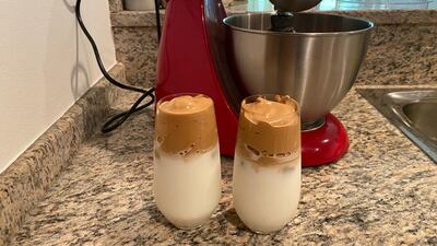 Step 4: Then spoon the coffee mixture on top of the milk to serve.