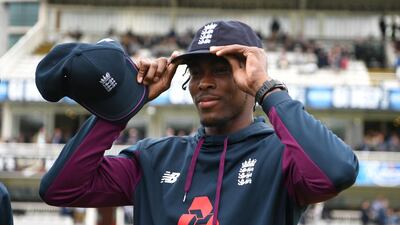 Jofra Archer of England is presented his test cap by Chris Jordan. Getty Images