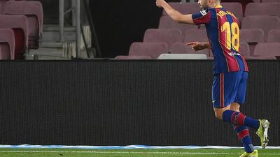 Barcelona's Spanish defender Jordi Alba celebrates after scoring the third goal. AFP