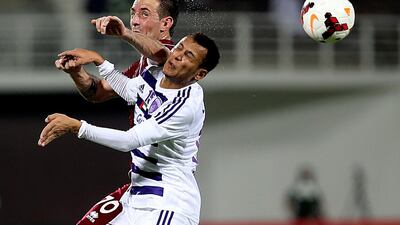 Al Ain, in white, had the upper hand in Abu Dhabi before Al Wahda equalised. Satish Kumar / The National