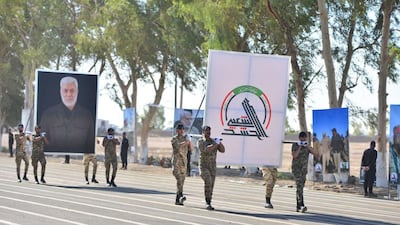 Members of Iraq's Popular Mobilisation Forces take part in a parade to mark the seventh anniversary of the organisation's founding at Camp Ashraf in Diyala province. AFP