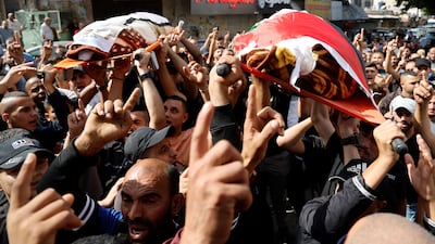 Relatives and friends attend the funerals of two Palestinian men killed in an Israeli air strike at Al Ansar Mosque in the occupied West Bank city of Jenin. Reuters