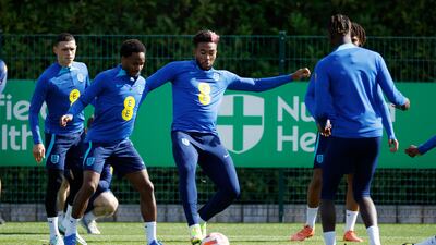 England's Raheem Sterling and Reece James with teammates during training. Reuters