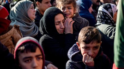 Relatives mourn at a funeral for two Syrian Democratic Forces (SDF) fighters in the Syrian Kurdish-majority city of Qamishli, after they were killed by a Turkish military drone, according to Kurdish security officials. AFP