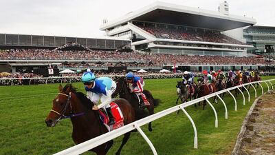 Admire Rakti, ridden by Zac Purton, rounds the bend on the first lap of the Melbourne Cup in Australia on Tuesday. Quinn Rooney / Getty Images / November 4, 2014