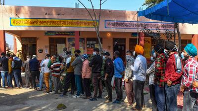 Voters in a village close to Amritsar queue to cast their ballots. AFP