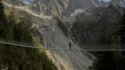 The new hiking trail to the Swiss Alpine Club's Sciora Hut, which passes through suspension bridges with views of Piz Cengalo and Badile in Bondo, Switzerland. EPA