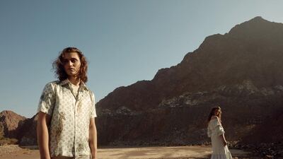 Star-crossed: On Jaffer, left, T-shirt, Dh170, Deus Ex Machina at Capital D Studio. Shirt, Dh5,400; trousers, Dh5,400, both from Louis Vuitton. On Iullia, right, dress, Dh349, Femi9. Shoes, Dh3,900, Céline