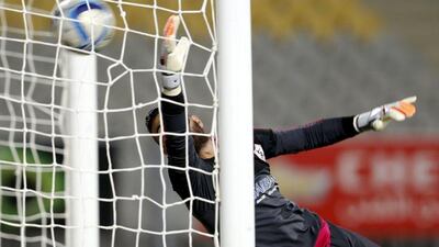 Al Ahly's Moamen Zakaria, unseen, scores past Zamalek keeper Ahmed El Shenawy on Tuesday in Ahly's 2-0 Egyptian Premier League victory. Amr Abdallah Dalsh / Reuters