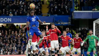 Chelsea defender Trevoh Chalobah heads the ball against Manchester United. AP