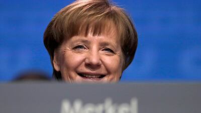 Chancellor Angela Merkel welcomed the outcome of the SPD vote, saying the collaboration will be "for the good of Germany". Markus Schreiber / AP