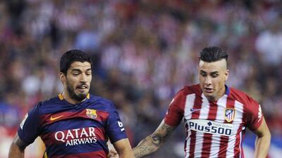 Barcelona were able to get a suspension on their 2014 transfer ban to sign Luis Suarez, left. Now Atletico Madrid, whom Barca play on Saturday, and Real Madrid have also been granted suspensions on their transfer bans from Fifa. Curto de la Torre / AFP