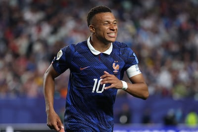 French player Mbappe wears the French strip with its distinctive retro collar. Getty Images