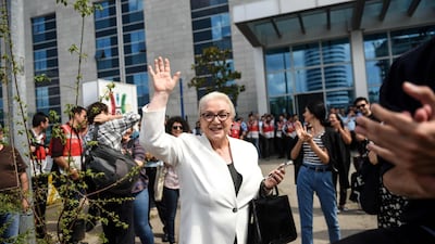 Ulya, mother of 28-year-old Turkish rapper Ezhel, whose real name is Omer Sercan Ipekcioglu, waves after he was released on June 19 in front of the Anadolu courthouse in Istanbul. AFP