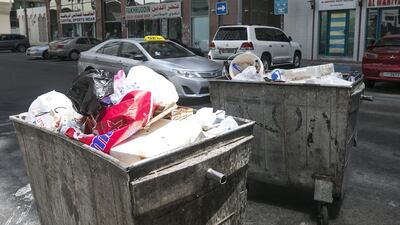 Bins in areas of Abu Dhabi with high levels of waste will have smart chips and sensors hidden inside them so that they can send a message asking to be emptied. Mona Al Marzooqi / The National