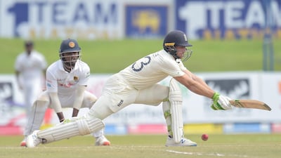 Jos Buttler plays a reverse sweep.