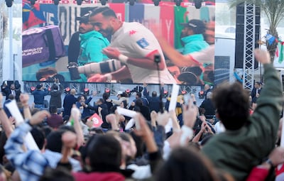 Tunisia soccer fans gather to watch their national team play against France on a large screen set up for fans in Tunis, Tunisia. AP