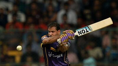 Kolkata Knight Riders’ batsman Yusuf Pathan plays a shot during the 2016 Indian Premier League (IPL) Twenty20 cricket match between Royal Challengers Bangalore and Kolkata Knight Riders at M Chinnaswamy Stadium in Bangalore on May 2, 2016. AFP / MANJUNATH KIRAN