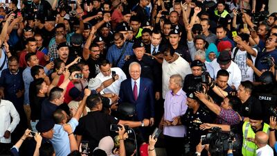 Najib Razak, Malaysia's former prime minister, leaves the Kuala Lumpur Courts Complex on Wednesday, July 4. Samsul Said / Bloomberg